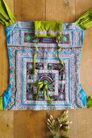 Handmade with a vintage Hmong tribe hand embroidery and Hemp Slings. One of a kind Ergonomic Babycarrier.  Mamma Nomad is rooted with Ethical values and growing forth the Sustainable way.